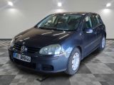 a blue car that is parked on a checkered floor