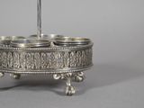 an image of a silver plate with three bowls on it