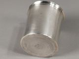 silver plated salt shaker sitting on a white surface