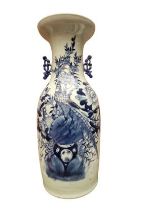 a blue and white vase with a bird on it