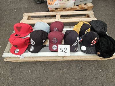 many hats on a pallet with a price tag