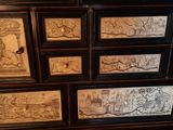 an image of a chest of drawers with many different designs