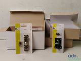 three boxes of different types of electronic devices on a table