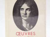 an old book with a picture of a woman in a black and white photo