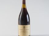 a bottle of wine that is sitting on a table