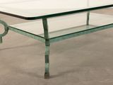 a glass table with a metal frame and a glass top