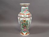 a vase that is sitting on a gray surface