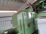 a green machine that is sitting in a building