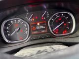a close up of a car dashboard with various gauges