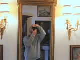 a man taking a picture of himself in the mirror