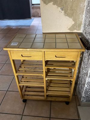an image of a kitchen cart on a tiled floor