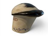 a black and white hat with writing on it