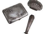 an image of a silver box with a spoon and spoon rest