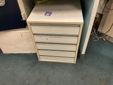 a file cabinet with drawers in the corner of a room