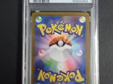 a close up of a pokemon card in a plastic case
