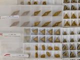 a lot of different types of metal parts in a box