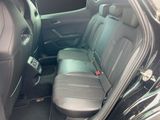 the back seat of a car with a seat belt in the back of it