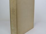 a book that is sitting on a white surface