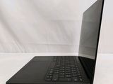 the back of a laptop computer sitting on top of a white surface