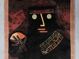 a picture of a painting of a face on a wall