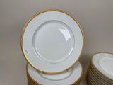 many plates stacked on top of each other on a table