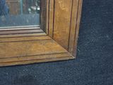 a reflection of a person in a mirror on the floor