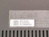 a close up of the back of a laptop with a sticker on it