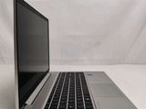 an open laptop computer sitting on top of a white table