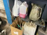 a shelf that has some bottles and containers on it