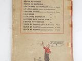 an old french book with a picture of a man and a dog