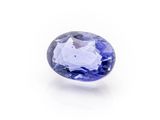 an oval tanzane blue sapphire gems on a white background