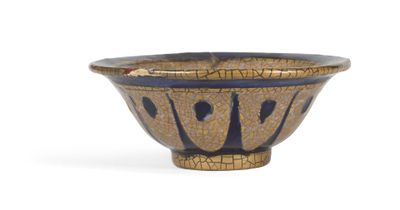 a brown and blue bowl sitting on a white surface