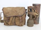two old gas masks and a bag on a white background