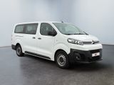 the white van is parked in the empty room of the building