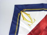 a red, white, and blue flag with a gold anchor on it