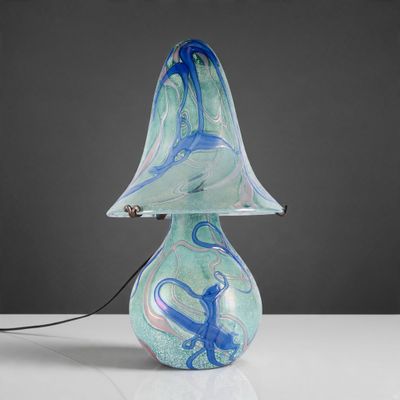 an image of a glass lamp with a blue and white swirl on it