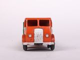 an orange toy truck sitting on top of a white surface
