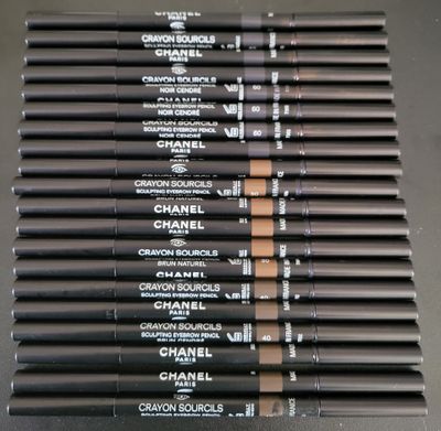 chanel brow pencils are lined up on a table