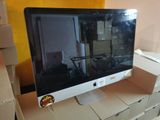 an apple computer monitor sitting on top of a cardboard box