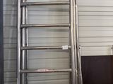 a ladder that is next to a box in a room