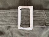 a small white object in the back pocket of a jacket