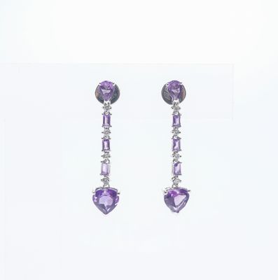 Paire de boucles d'oreilles en or blanc serti de 8 brillants…