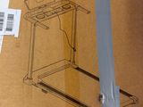cardboard box with a drawing of a laptop on it sitting on top of a table