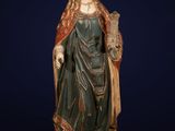 a statue of a woman holding a bird in her hand