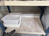 a shelf that has a lot of pots and pans on it
