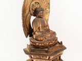 an image of a statue of a person sitting on a pedestal
