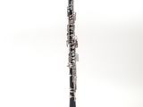 a close up of a clarinet on a white surface with a white background