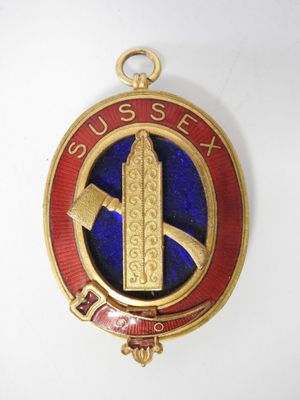 an image of a badge with a hammer on it