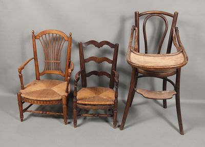 three wooden chairs and a chair with a cushion on top of them