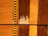 a close up of a wooden box with holes in it